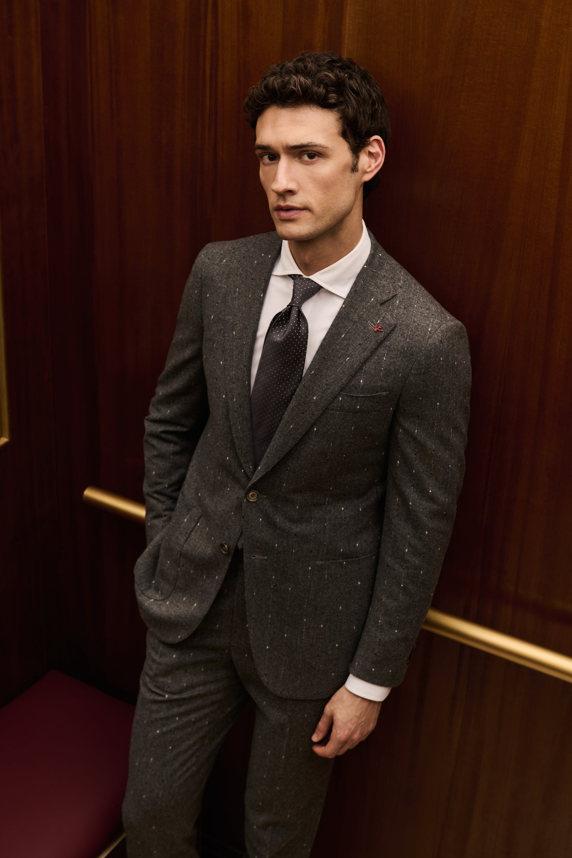ISAIA Made to Measure: charcoal flecked wool suit with white shirt and grey tie