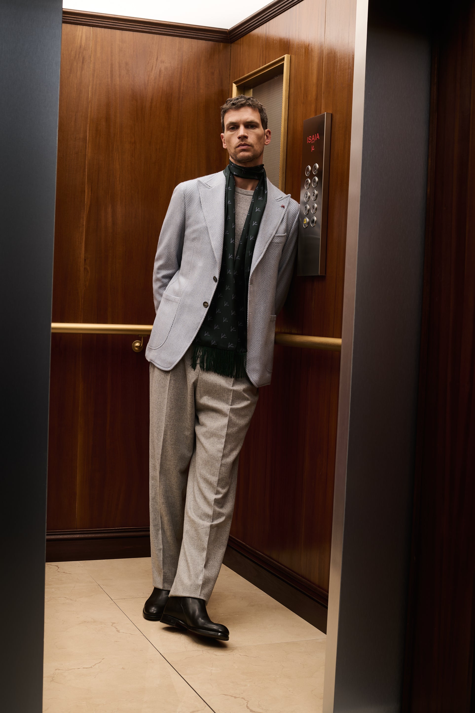 ISAIA Made to Measure: light grey jacket with green patterned scarf and grey pleated trousers