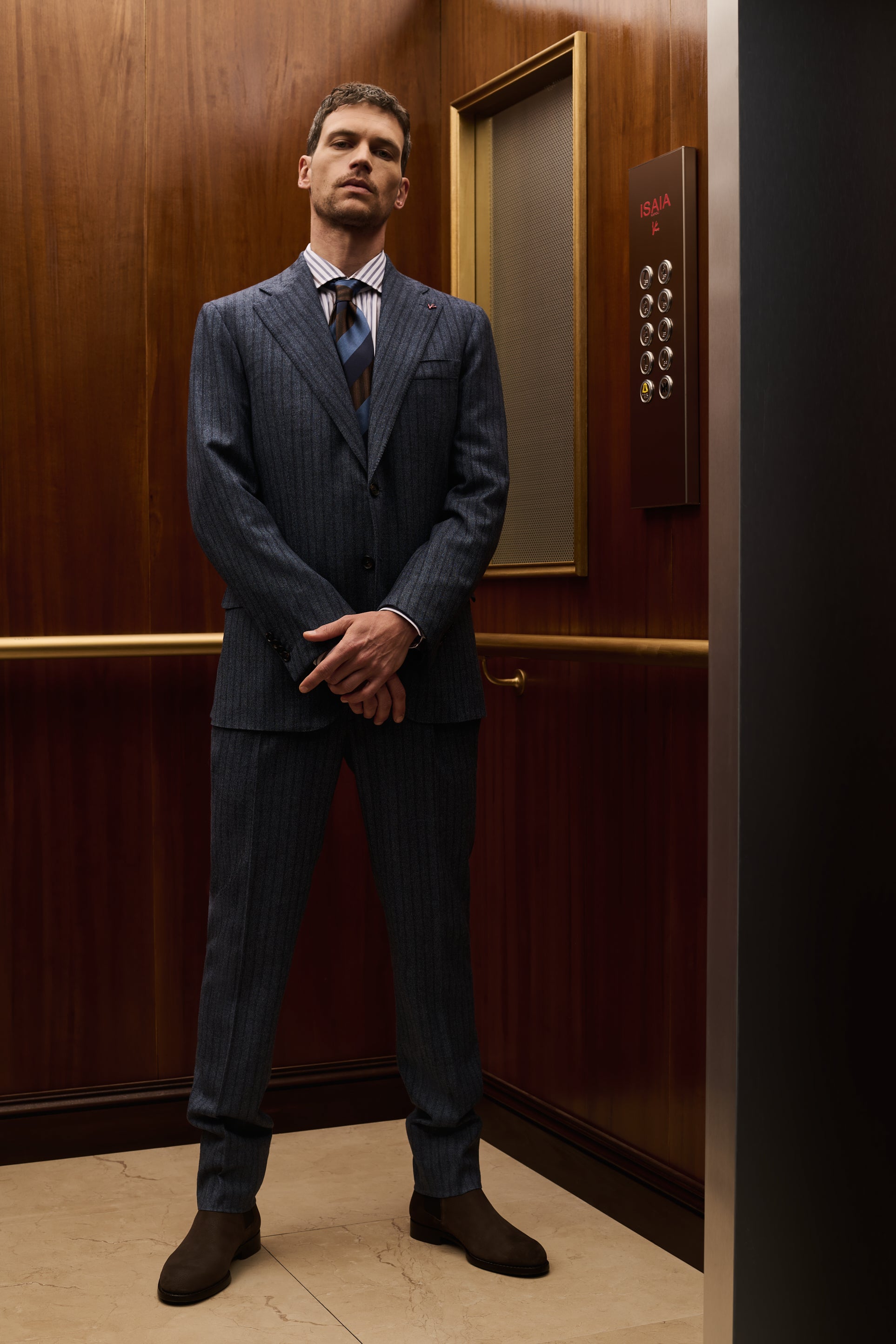 ISAIA Made to Measure: navy pinstripe suit with striped shirt and blue tie