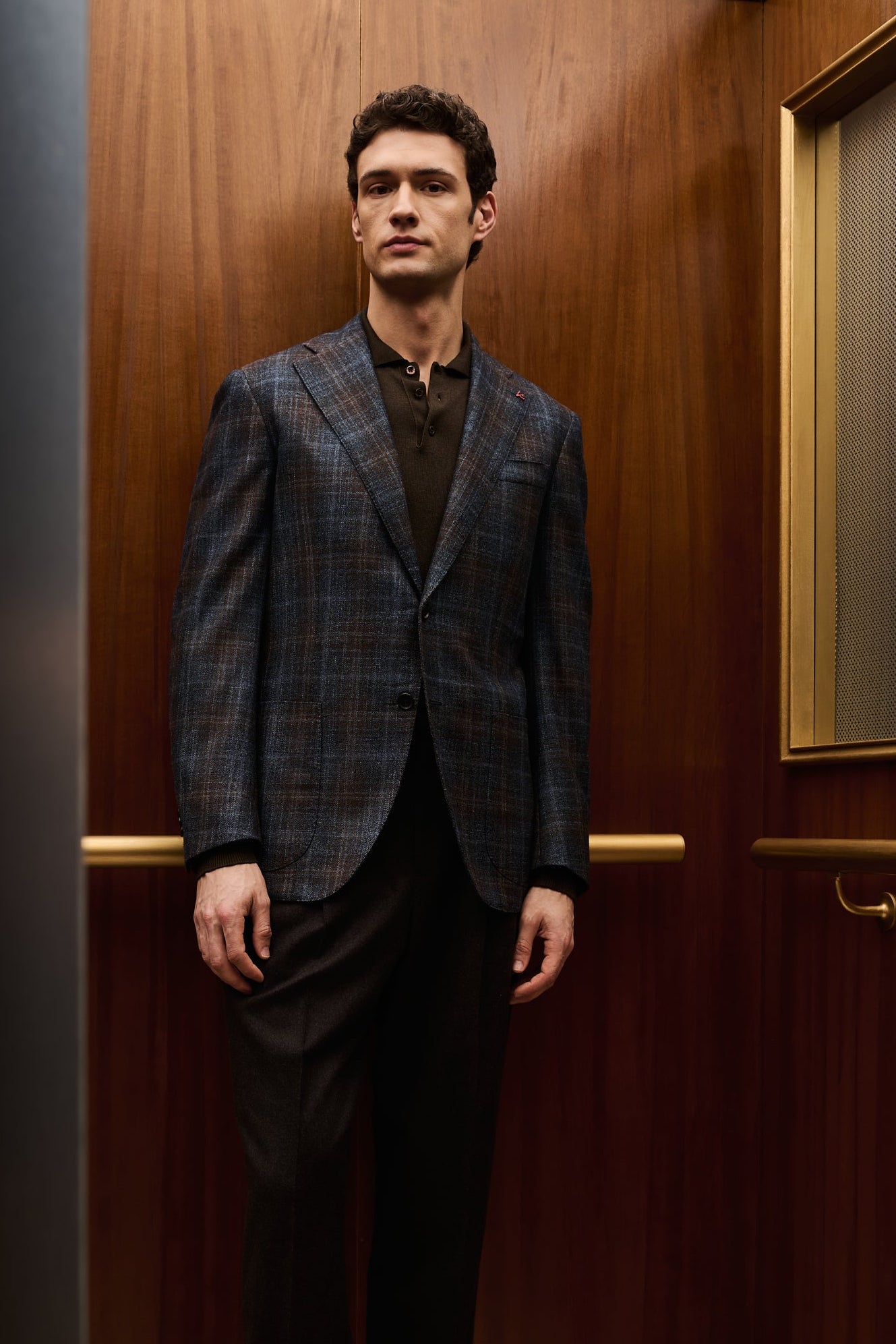 ISAIA Made to Measure: blue and brown check jacket with brown polo shirt and dark trousers
