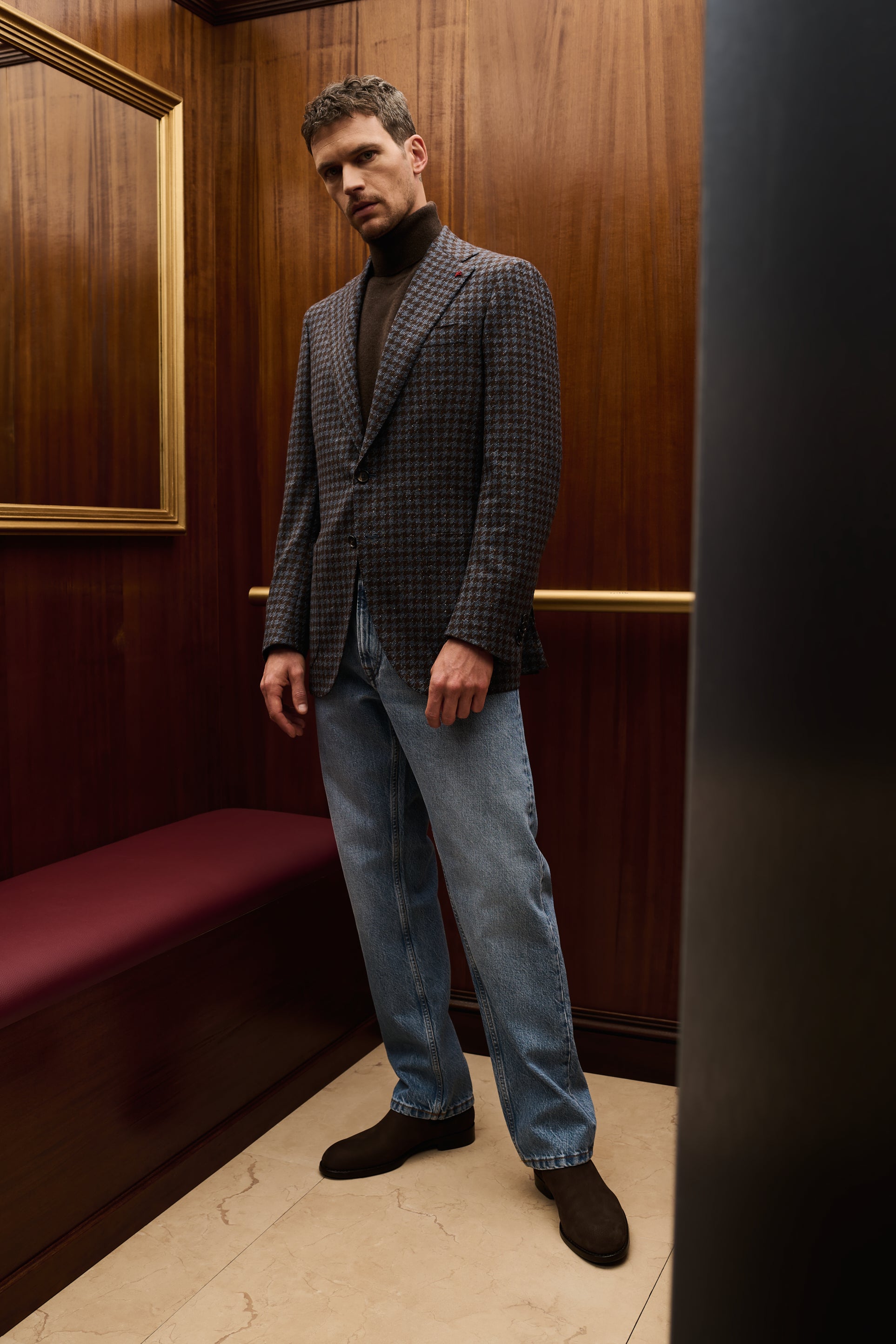 ISAIA Made to Measure: brown check jacket with black rollneck and light blue jeans