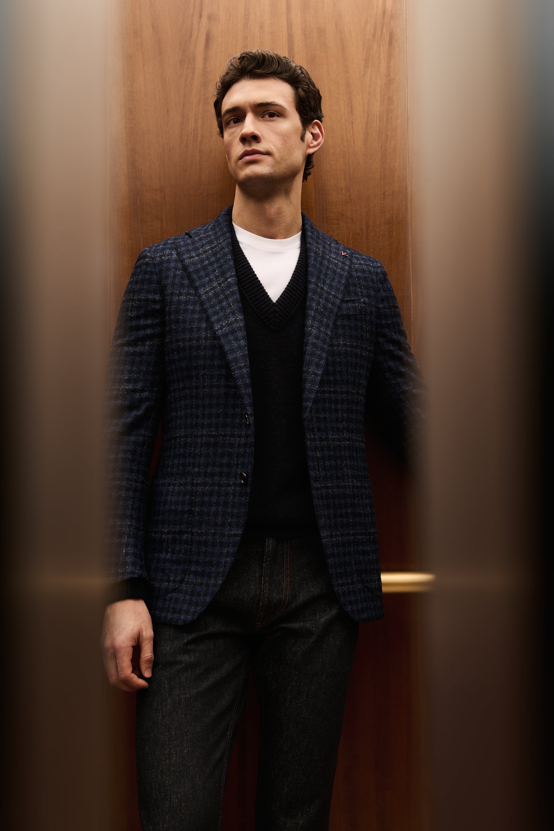 ISAIA Made to Measure: navy check jacket with black V-neck sweater and white T-shirt