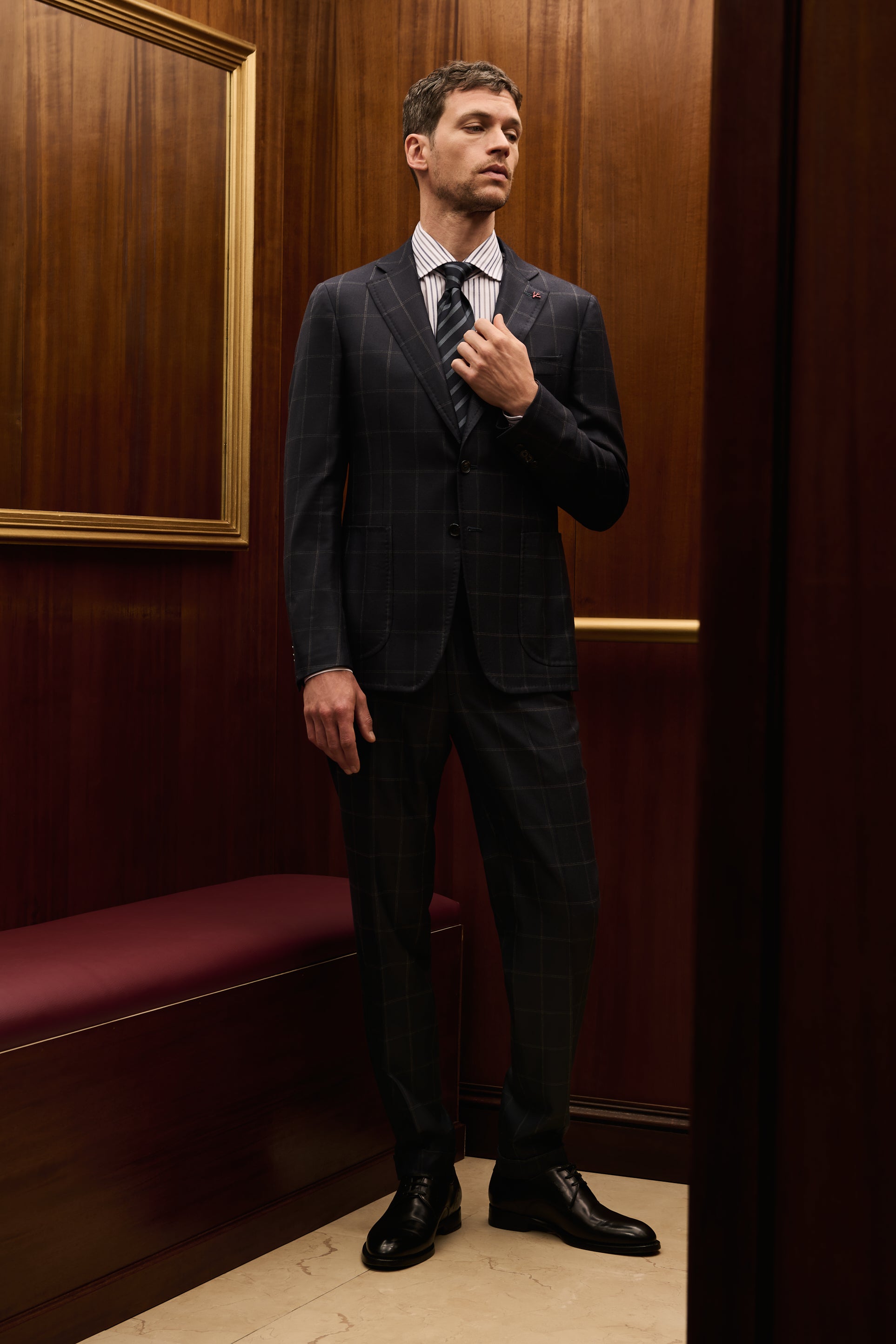 ISAIA Made to Measure: charcoal windowpane check suit with striped shirt and tie